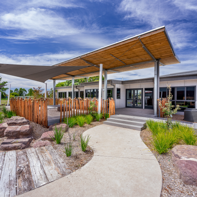 KOSS 2021 — covered outdoor learning breezeway with landscaped garden