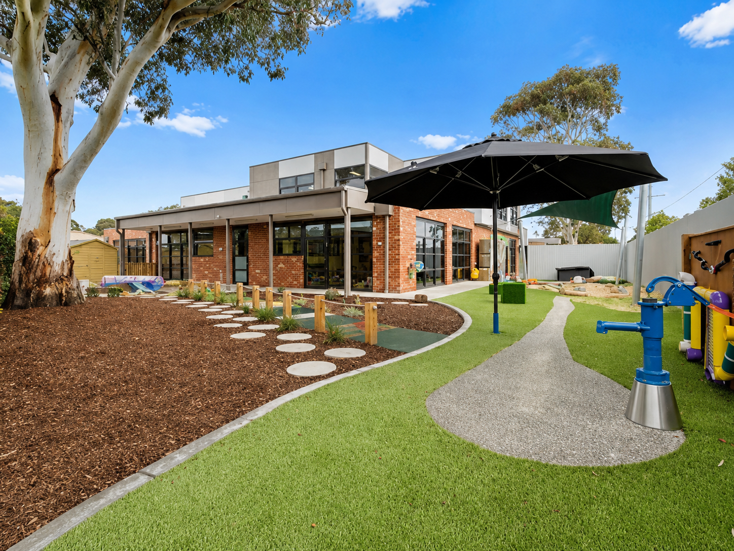 KOSS 2021 — kindergarten building exterior with landscaped entry path