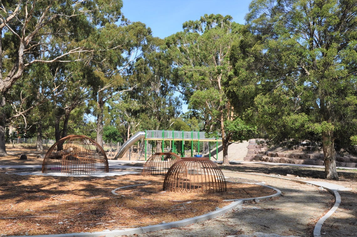 Wattlepark Upgrade — cubby-dome climbers with slide beyond